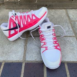 White pink and black Nike tennis shoes